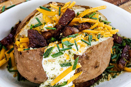 Fire & Smoke Society F&S Onion Butter All Purpose Blend 9.2 Oz, seasoned baked potato topped with sour cream, shredded cheddar cheese, chopped chives, and crispy bacon pieces.