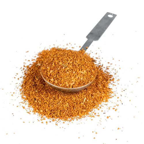 Fire & Smoke Society F&S Sweet Preacher Pork Rub 11.9 oz, ground spice rub in a metal spoon with some scattered around on a black background.