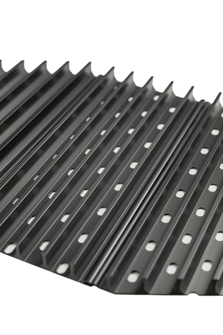 GrillGrate® for The PKGO, black metal grilling grate with elongated ridges and evenly spaced holes, designed to optimize grilling performance on The PKGO portable grill.