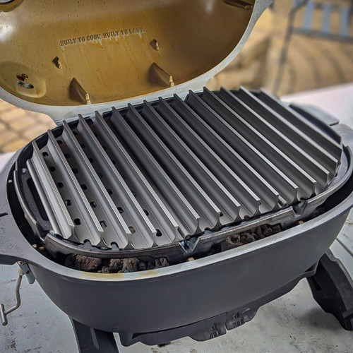 GrillGrate® for The PKGO, a stainless steel cooking grate with raised ridges designed for use on a portable grill, ideal for grilling meats and vegetables.