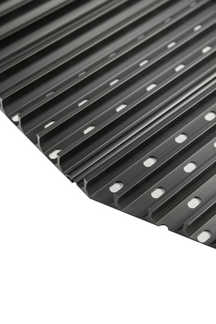 GrillGrate® for The PKGO, a black metal grilling grate with slotted design and circular holes for enhanced grilling performance.
