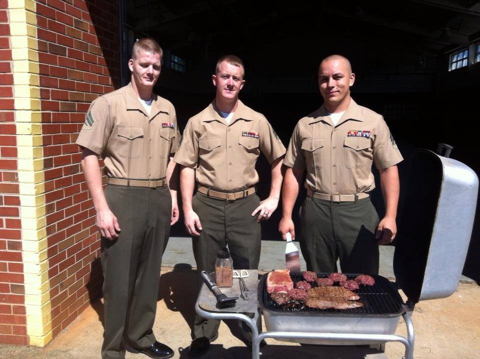 Military personnel using a PK Grill