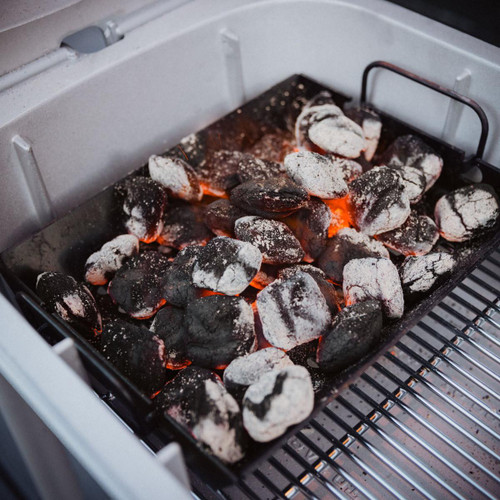 PK Grills PK300 Start Cookin' Bundle - Silver, charcoal briquettes in a grill with glowing embers ready for cooking.