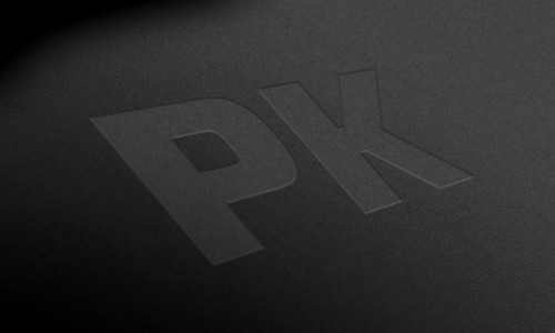 PK Grills PK360 Carbon Steel Griddle, close-up of the engraved PK logo on the griddle's surface.