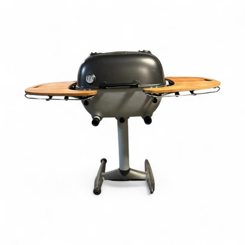 PK Grills PK360 Mismatched with Teak Shelves, imperfect outdoor portable charcoal grill with wooden side shelves, stainless steel body and adjustable temperature gauge.