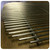 PK Grills Stainless Steel Cooking Grid & Charcoal Grate for Original PK, stainless steel cooking grid and charcoal grate laid out on a wooden surface.