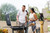 PK Grills The All New Original PK300AF Grill & Smoker - Coal, people enjoying outdoor barbecue with friends and family.