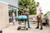 PK Grills The All New Original PK300AF Grill & Smoker - Teal, outdoor gathering with friends on patio.