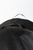 PK Grills The All New PK360 Slim Cover, close-up of black outdoor grill cover with reinforced handle and orange stitching detail.