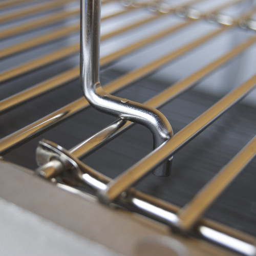PK Grills The Littlemore Grid for PK Grills, close-up view of the stainless steel grilling grid with gold-tone bars and supporting hook