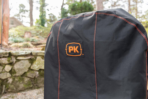 PK Grills The NEW PK300 Slim Cover, black grill cover with orange stitching and PK logo for outdoor barbecue protection.