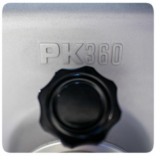 PK Grills The PK360 Grill & Smoker - Classic Silver, close-up of the engraved product name and a black control knob on the grill body.