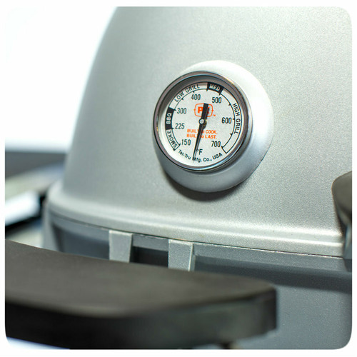 PK Grills The PK360 Grill & Smoker - Classic Silver, close-up of the built-in temperature gauge on the grill showing temperature in Fahrenheit with settings for low, medium, and high grill, smoker, and bake.