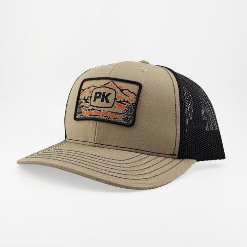 PK Legend Khaki Hat, trucker style cap with embroidered patch featuring mountains and sunset on the front, mesh back for ventilation, beige and black color combination.