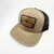PK Legend Khaki Hat, beige and black trucker cap with embroidered outdoor mountain scene and PK logo patch, stylish men's accessory with breathable mesh back.