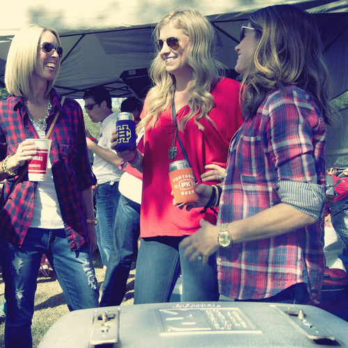 Portable Beer Drink Koozie set of 2, showing two women holding cans with koozies at outdoor gathering.